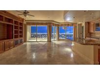 Spacious living room with city views and built-in shelving at 9101 Alta Dr # 1406, Las Vegas, NV 89145