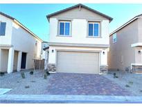 Two-story house with neutral color scheme and a two-car garage at 4763 Illustria Ave, Las Vegas, NV 89141