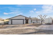 Single story home with attached two-car garage and landscaping at 4767 Del Sueno Dr, Las Vegas, NV 89120