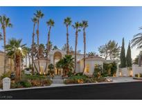 Stunning two-story home with palm trees and landscaped grounds at 8109 Moonstone Cir, Las Vegas, NV 89128