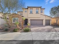 Two-story house with stone accents and a three-car garage at 1090 Via Pareda Pl, Henderson, NV 89011