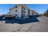 Well-maintained condo building featuring ample parking and private balconies with awnings and mountain views at 3550 Bay Sands Dr # 2076, Laughlin, NV 89029