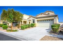 Charming two-story home features desert landscaping, a two-car garage, and a well-maintained lawn at 3652 Remington Grove Ave, North Las Vegas, NV 89081