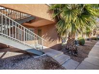 Building exterior with stairs, palm tree, and walkway at , Henderson, NV 89014