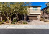 Two-story house with brown garage door and landscaped front yard at 112 Nola Stream Ct, Las Vegas, NV 89183