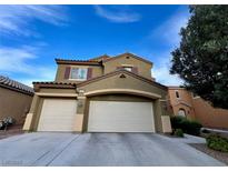 Two-story home showcasing a 3-car garage, shutters, and neutral color palette under a bright blue sky at 4920 Blue Rose St, North Las Vegas, NV 89081