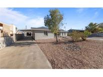 Single story home with front yard landscaping and gated driveway at 112 Joshua St, Henderson, NV 89015