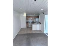 Charming kitchen with tiled floors, modern appliances, and plenty of storage space at 1381 E University Ave # 102, Las Vegas, NV 89119