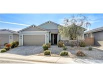 Charming single-story home with desert landscaping, a two-car garage, and a welcoming entryway at 2391 Dalewood Ave, North Las Vegas, NV 89086