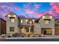 Stunning two-story home with stone accents and landscaped yard at 11250 Torch Cactus Dr, Las Vegas, NV 89138