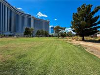 Scenic view of a lush green golf course with a resort in the background at 2831 Geary Pl # 2921, Las Vegas, NV 89109