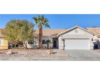 Single-story house with a two-car garage and desert landscaping at 5125 Coral Beach St, North Las Vegas, NV 89031