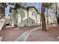 Spanish style building exterior with a walkway and landscaping at 6804 Elm Creek Dr # 102, Las Vegas, NV 89108