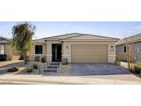 Charming single-story home featuring a well-manicured front yard and inviting curb appeal at 2395 Dalewood Ave, North Las Vegas, NV 89086