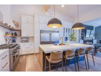 Modern kitchen with stainless steel appliances and white cabinetry at 5378 Pendini Point Ct, Las Vegas, NV 89141