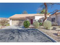 Single-story home with attached garage and landscaping at 256 Garfield Dr, Henderson, NV 89074