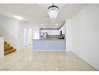 Bright kitchen with stainless steel appliances and granite countertops at 2120 Waterlily View St, Henderson, NV 89044