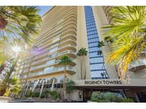 Regency Towers building exterior, featuring palm trees and building signage at 3111 Bel Air Dr # 4G, Las Vegas, NV 89109