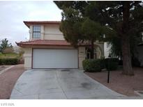 Two-story house with attached garage and landscaped yard at 4801 Fiesta Lakes St, Las Vegas, NV 89130