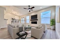 Bright living room with fireplace and hardwood floors at 10173 Grants Arbor Rd, Las Vegas, NV 89183