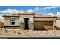 Charming single-story home featuring a two-car garage, neutral stucco, and stone accents for added curb appeal at 129 Castanet Ln # Lot 190, Henderson, NV 89015
