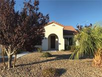 Single-story house with desert landscaping and Spanish-style architecture at 2416 Weaverville Dr, Henderson, NV 89044