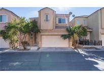 Two-story house with attached garage and landscaping at 6641 Hurkling Stone Ave, Las Vegas, NV 89139