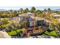 Beautiful home with desert landscaping, tile roof and palm trees at 7880 Dana Point Ct, Las Vegas, NV 89117