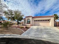 Single-story house with a two-car garage and nicely landscaped front yard at 8116 Sedona Sunset Dr, Las Vegas, NV 89128