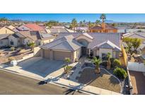 Aerial view of a single-Gathering home with a two-car garage and desert landscaping at 816 Sandsprings St, Henderson, NV 89011