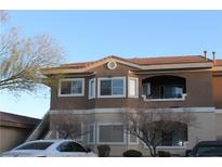 Two-story condo building with brown exterior and tiled roof at 833 Aspen Peak Loop # 2225, Henderson, NV 89011