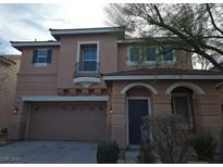 Two-story house with attached garage and balcony at 8809 Early Horizon Dr, Las Vegas, NV 89178