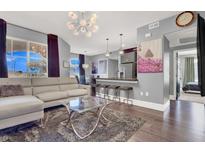 Open living area with hardwood floors, stylish furniture, and a view into the kitchen at 9000 Las Vegas Blvd # 2222, Las Vegas, NV 89123