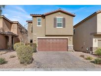 Two-story house with brown garage door and landscaped yard at 9202 Valley Betica Ave, Las Vegas, NV 89148