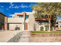 Modern two-story home with a landscaped front yard and two-car garage at 10226 Jade Gardens Dr, Las Vegas, NV 89135