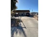 Ranch style home with driveway and gated entrance at 217 Jackson Ave, Las Vegas, NV 89106