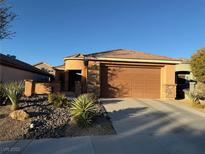 Single-story home with attached garage and desert landscaping at 2736 Mintlaw Ave, Henderson, NV 89044