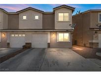 Two-story townhome with a two-car garage and driveway at 4039 Halfmoon Bay Dr, Las Vegas, NV 89115