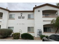 Two story building exterior with light colored walls and balconies at 5650 E Sahara Ave # 2029, Las Vegas, NV 89142