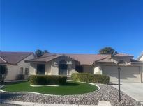 Single-story home with landscaped yard and two-car garage at 5728 Palma Del Sol Way, Las Vegas, NV 89130