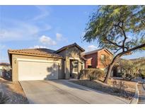 One-story house with a two-car garage and desert landscaping at 6452 Casamar St, North Las Vegas, NV 89086