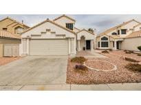 Two-story house with attached garage and landscaped yard at 8424 Oyster Dr, Las Vegas, NV 89128