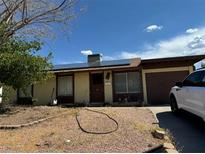 Ranch-style home with solar panels and a spacious yard at 220 Dogwood St, Henderson, NV 89015