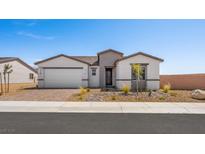 Charming single-story home with a well-manicured front yard and a two-car garage on a clear day at 4540 S Pienza Ct, Pahrump, NV 89061