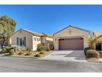 One-story house with landscaped front yard, two-car garage, and neutral color palette at 2470 Lothian St, Henderson, NV 89044