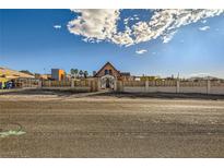 A charming one-story home with a unique architectural style and a fenced yard at 919 Havre Ave, Henderson, NV 89015