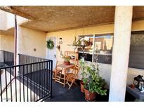 Cozy balcony with outdoor seating, potted plants, and a view; perfect for relaxing and enjoying the fresh air at 1303 Darlene Way # 102B, Boulder City, NV 89005