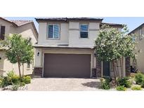 Two-story house with attached garage and landscaping at 8132 Willmann St, Las Vegas, NV 89178