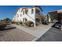 Two story building exterior with walkway, stairs, and covered parking at 5655 E Sahara Ave # 2024, Las Vegas, NV 89142