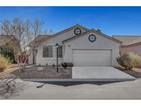 Charming single-story home boasts a two-car garage, low maintenance landscaping, and lots of curb appeal at 5919 Pavilion Lakes Ave, Las Vegas, NV 89122